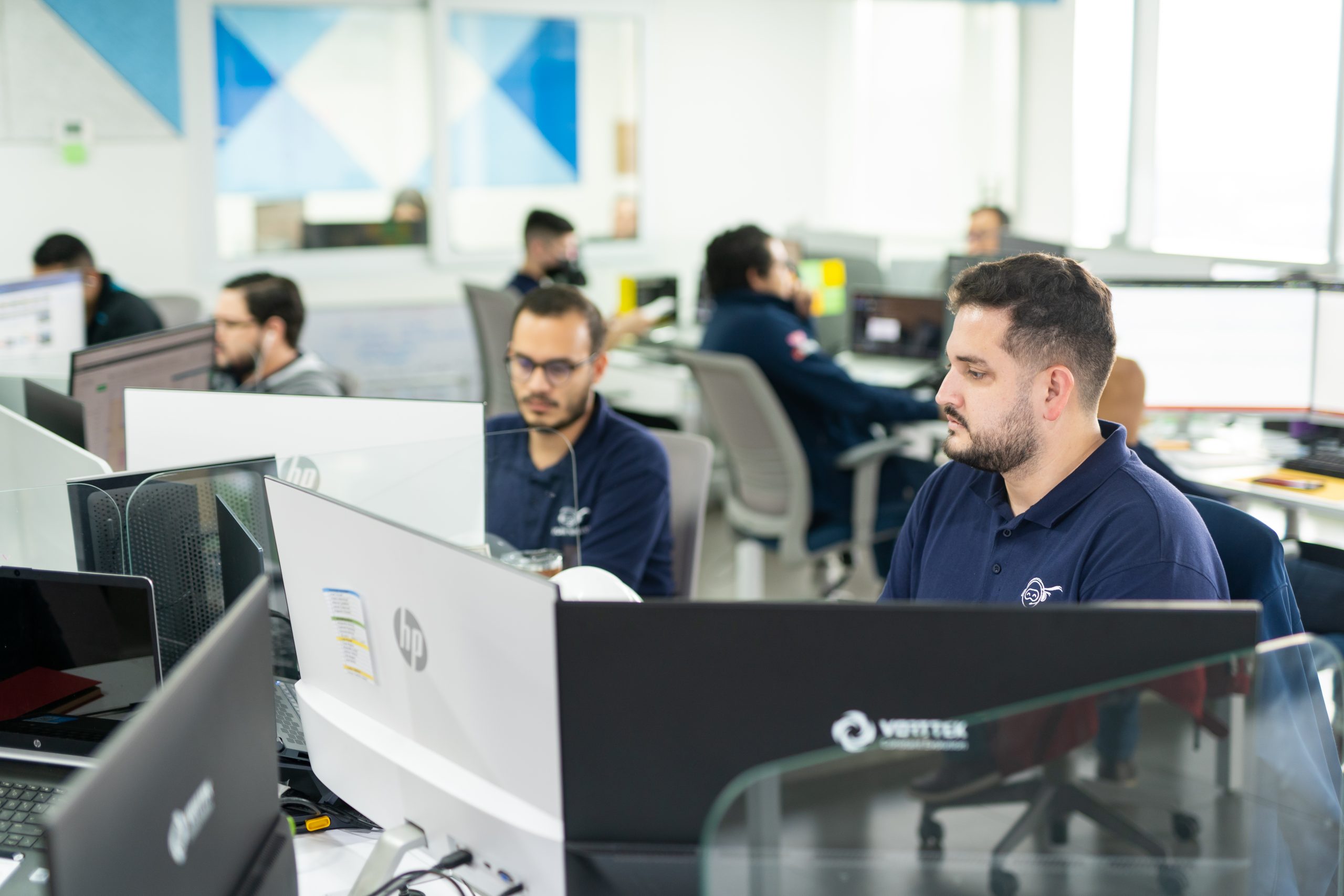 The Work Ninjas bullpen — bilingual agents at work in the San Pedro Sula office